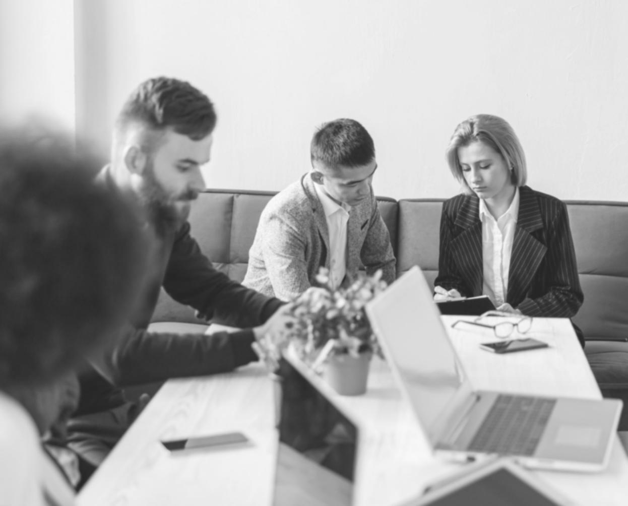 Professional video editing workspace with multiple monitors displaying timeline and color correction tools